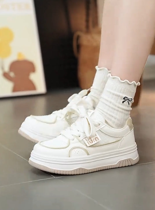 Soft-soled and soft-surfaced white casual shoes