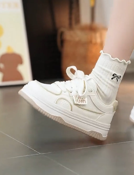 Soft-soled and soft-surfaced white casual shoes