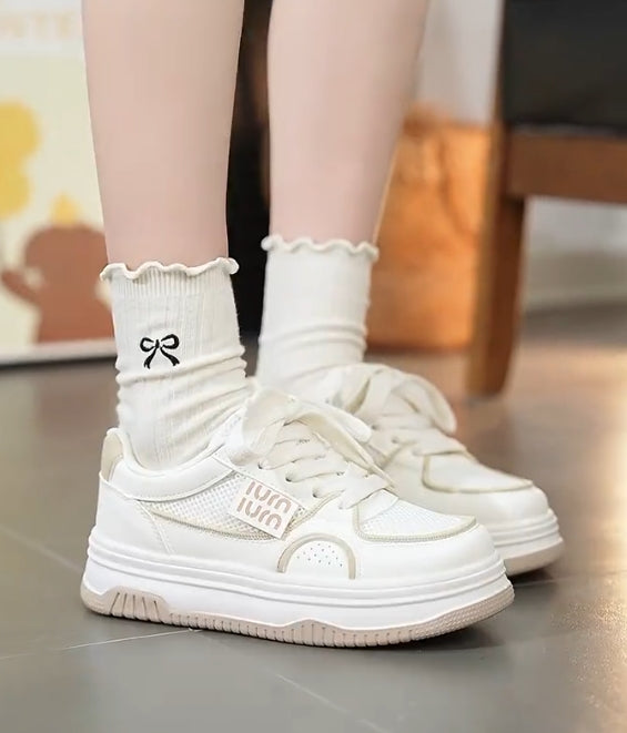 Soft-soled and soft-surfaced white casual shoes