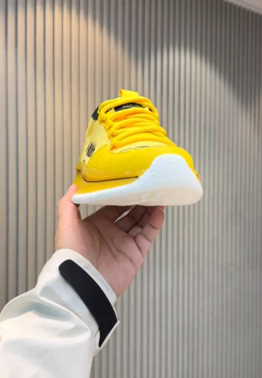 Yellow and black mesh cheetah sneakers