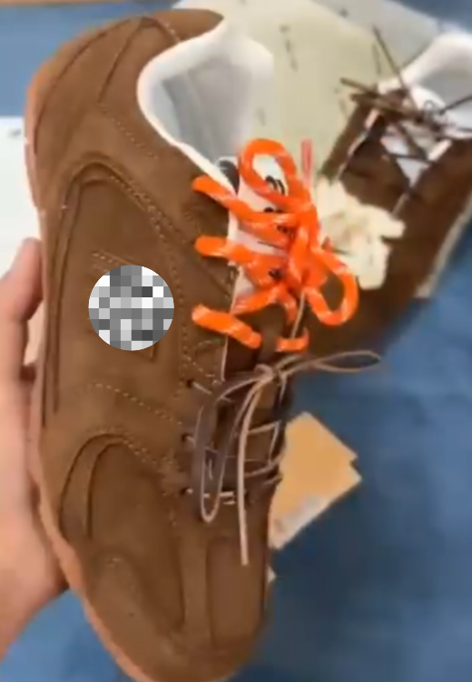 Tan sneakers orange shoelaces
