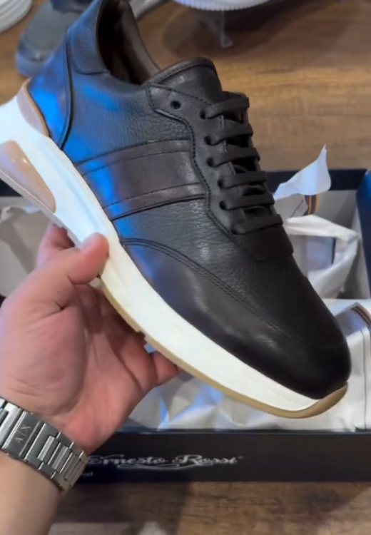 Brown running shoes with white soles