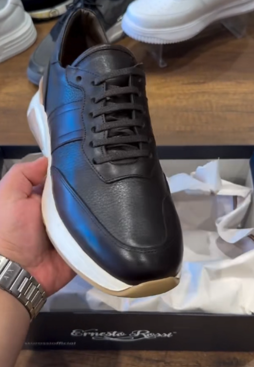 Brown running shoes with white soles