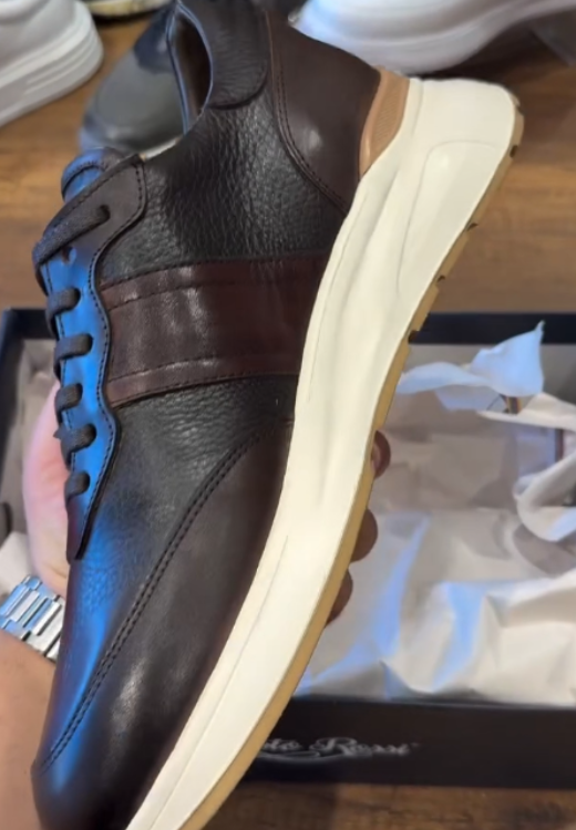Brown running shoes with white soles