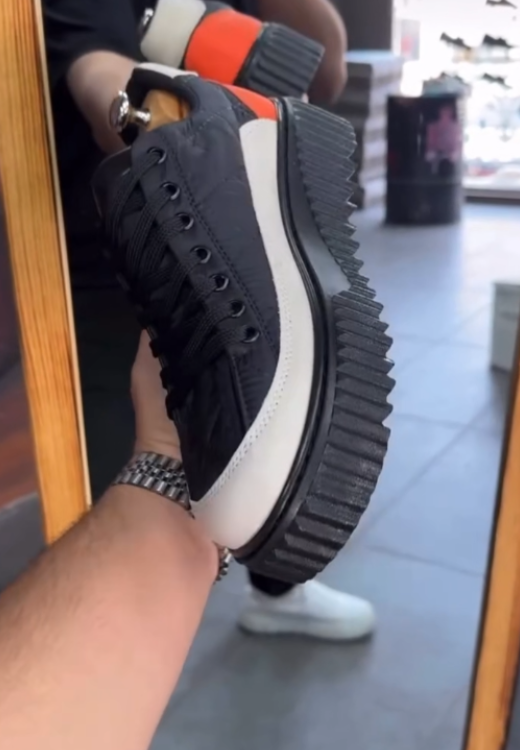 Soft-faced leisure shoes with waterproof and raised soles