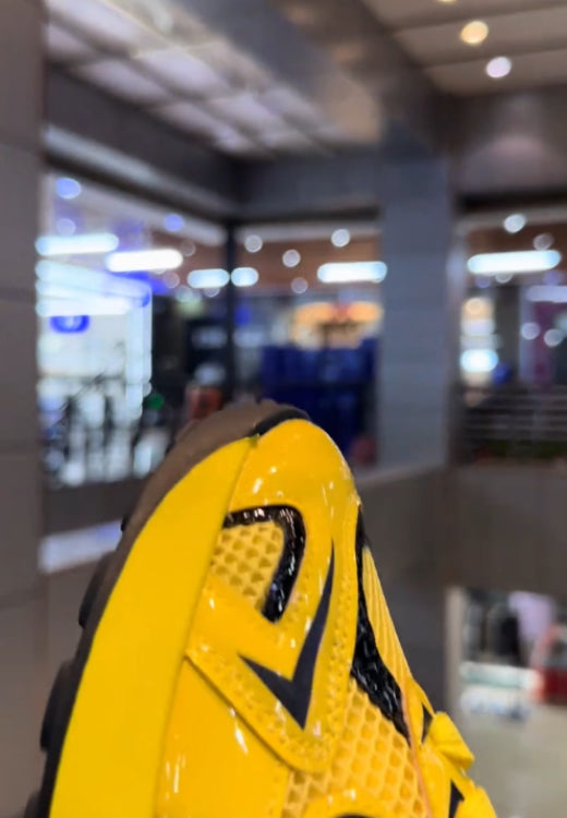 Functional style yellow and black sneakers