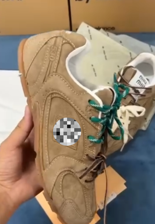 Tan sneakers orange shoelaces